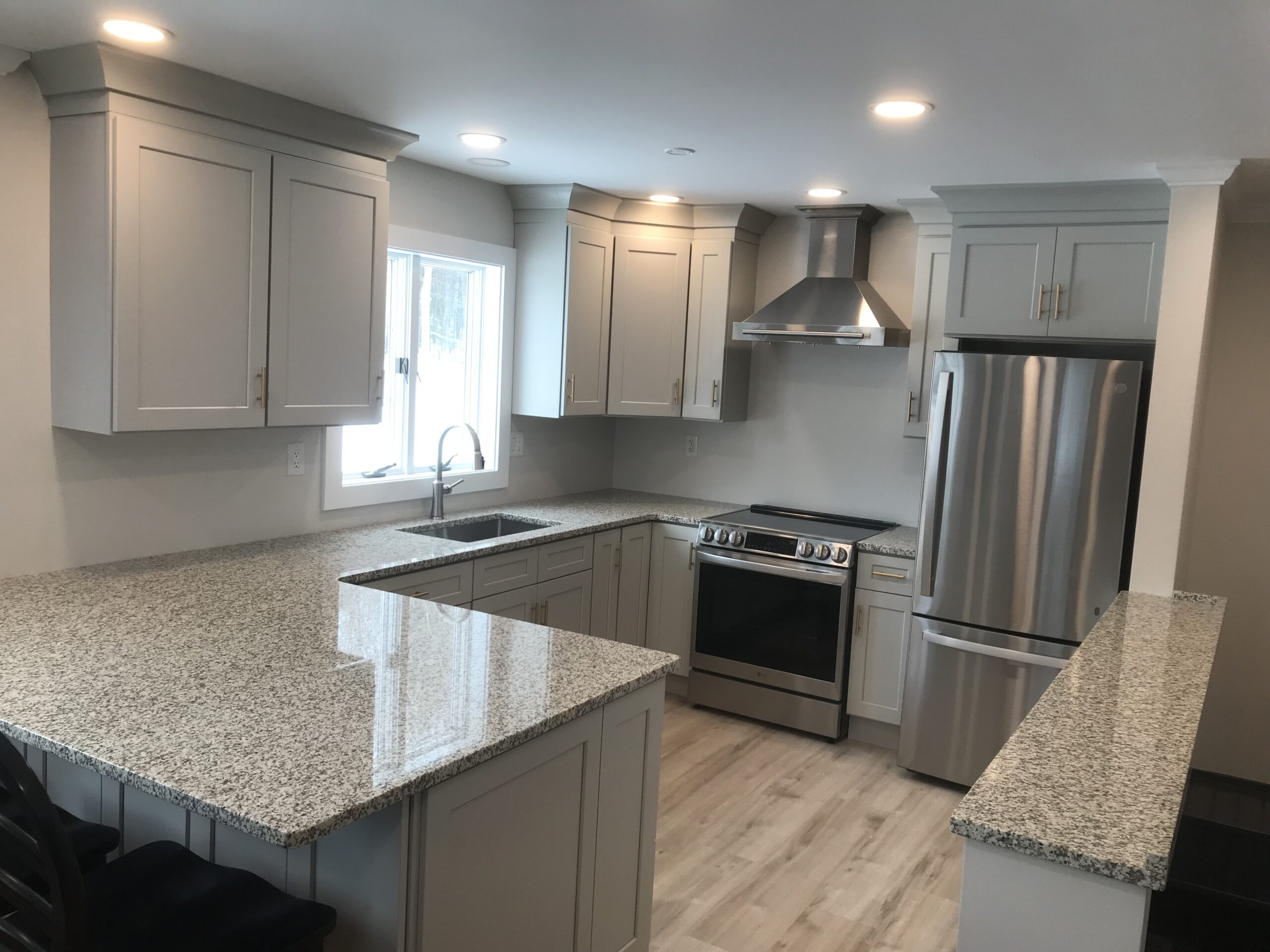 A stunning kitchen with great attention to detail on the natural stone countertops